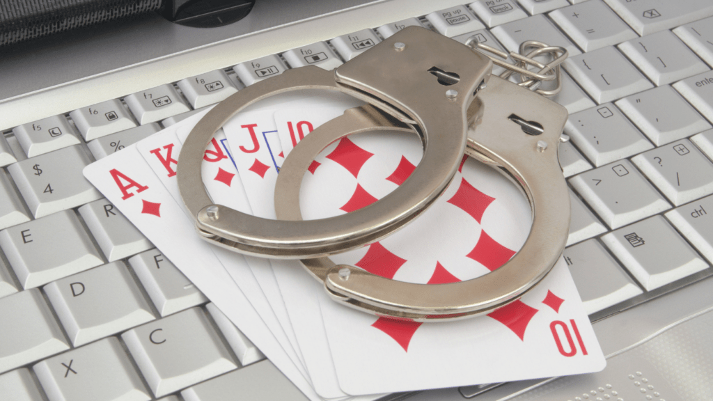 Playing cards, handcuffs and keyboard